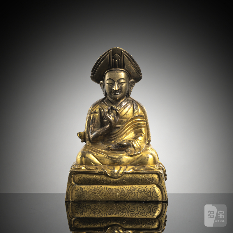 A parcel-gilt bronze figure of lama